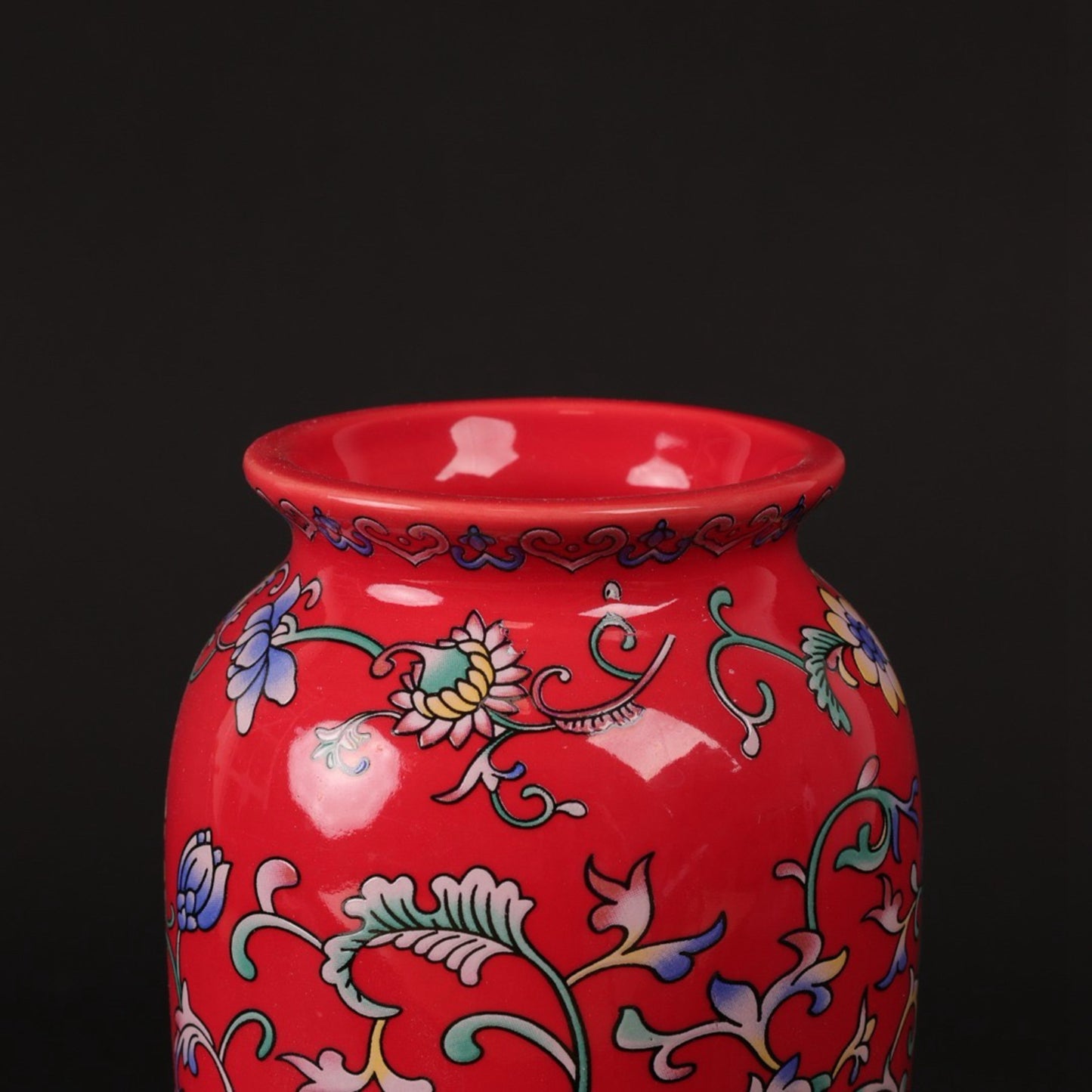 Red enamel with tangled branches and small flower arrangements