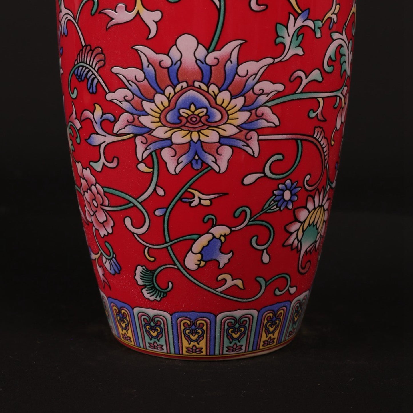 Red enamel with tangled branches and small flower arrangements