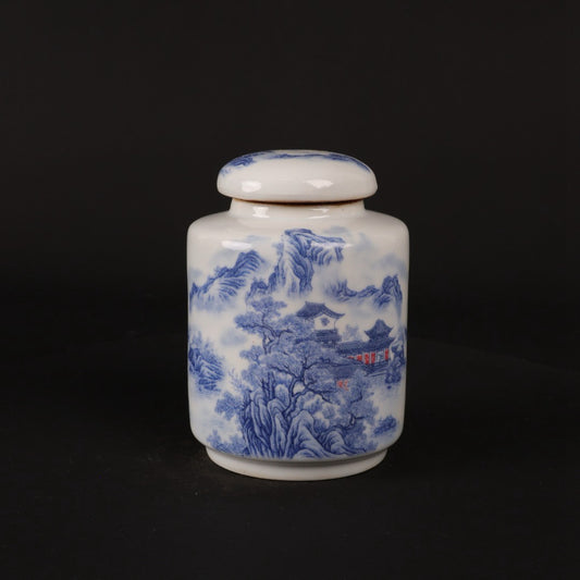 Blue and white landscape patterned tea jar