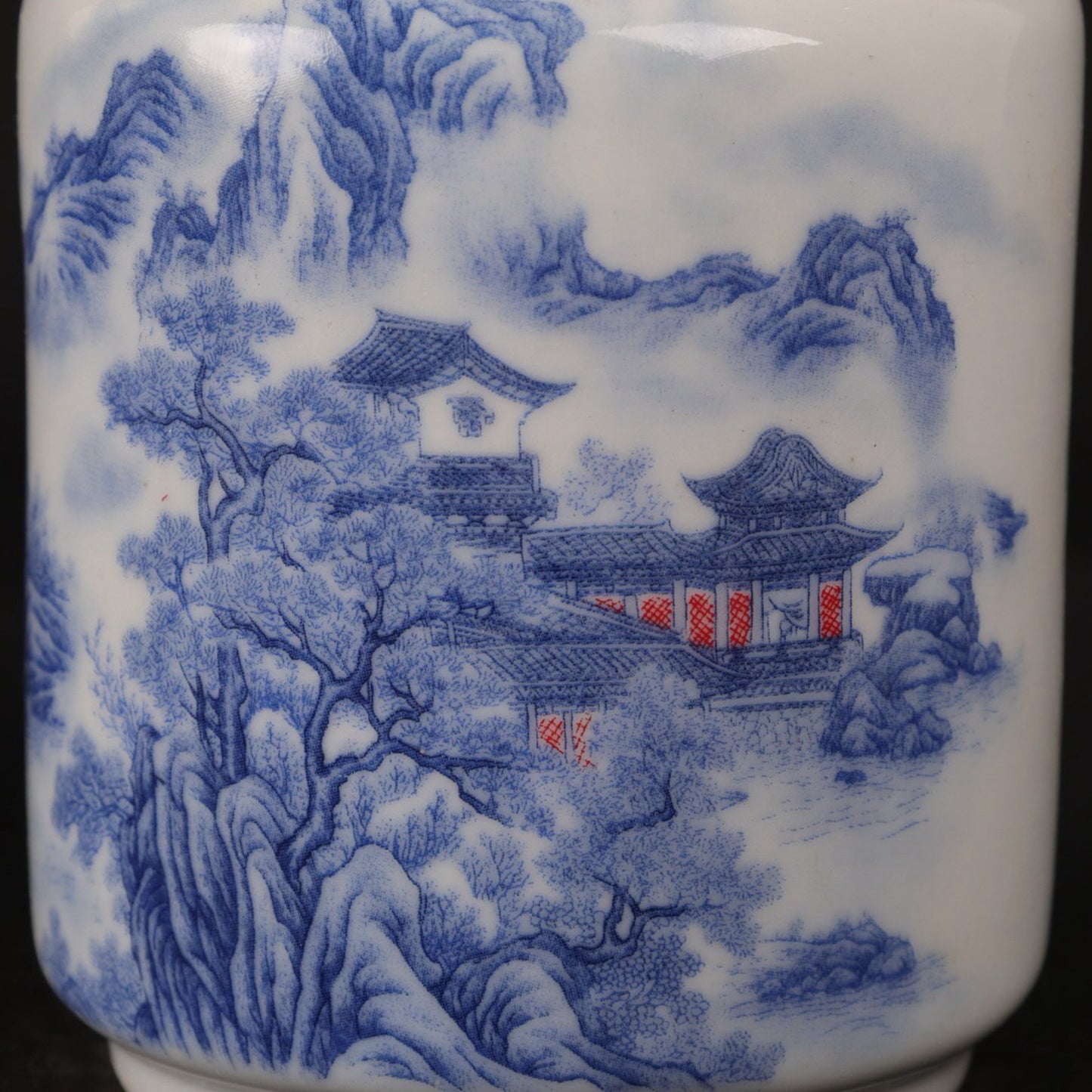 Blue and white landscape patterned tea jar