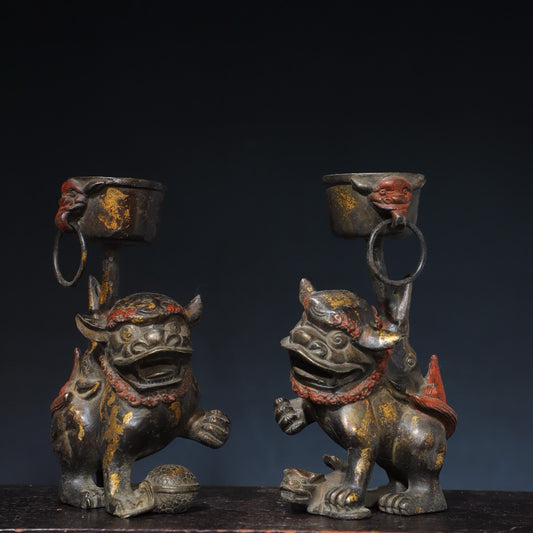 A pair of Chinese antique pure copper lion wax stands