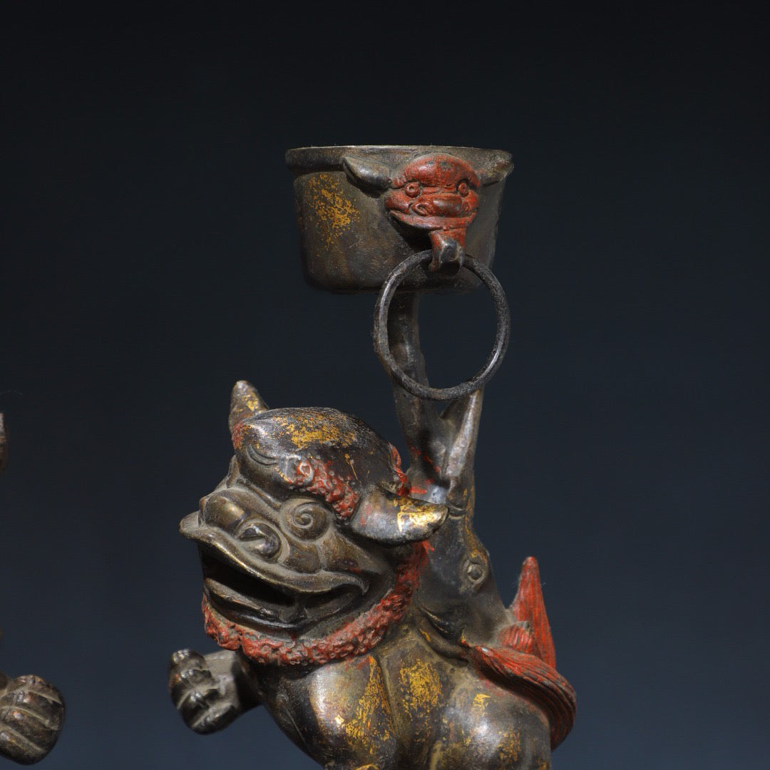 A pair of Chinese antique pure copper lion wax stands