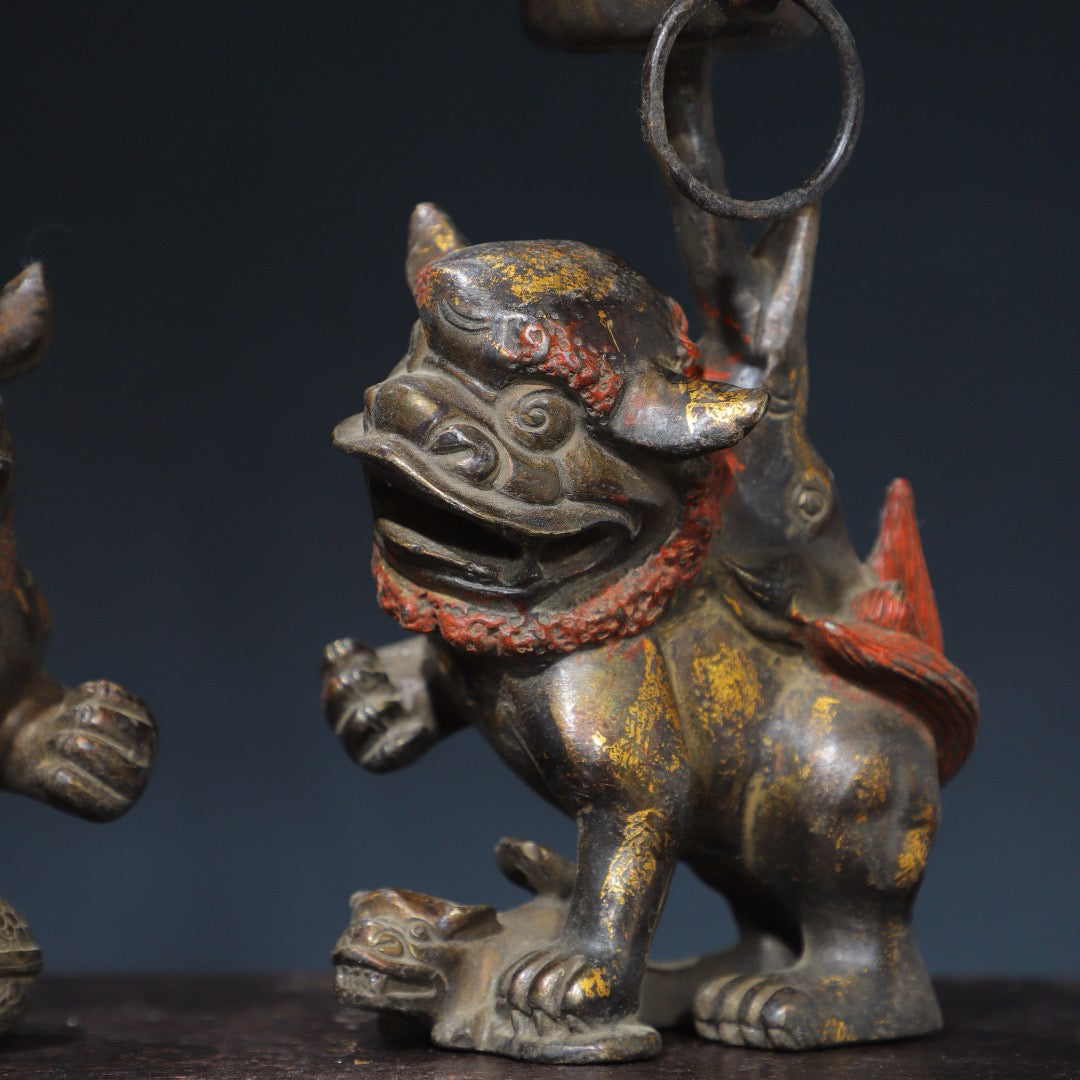 A pair of Chinese antique pure copper lion wax stands