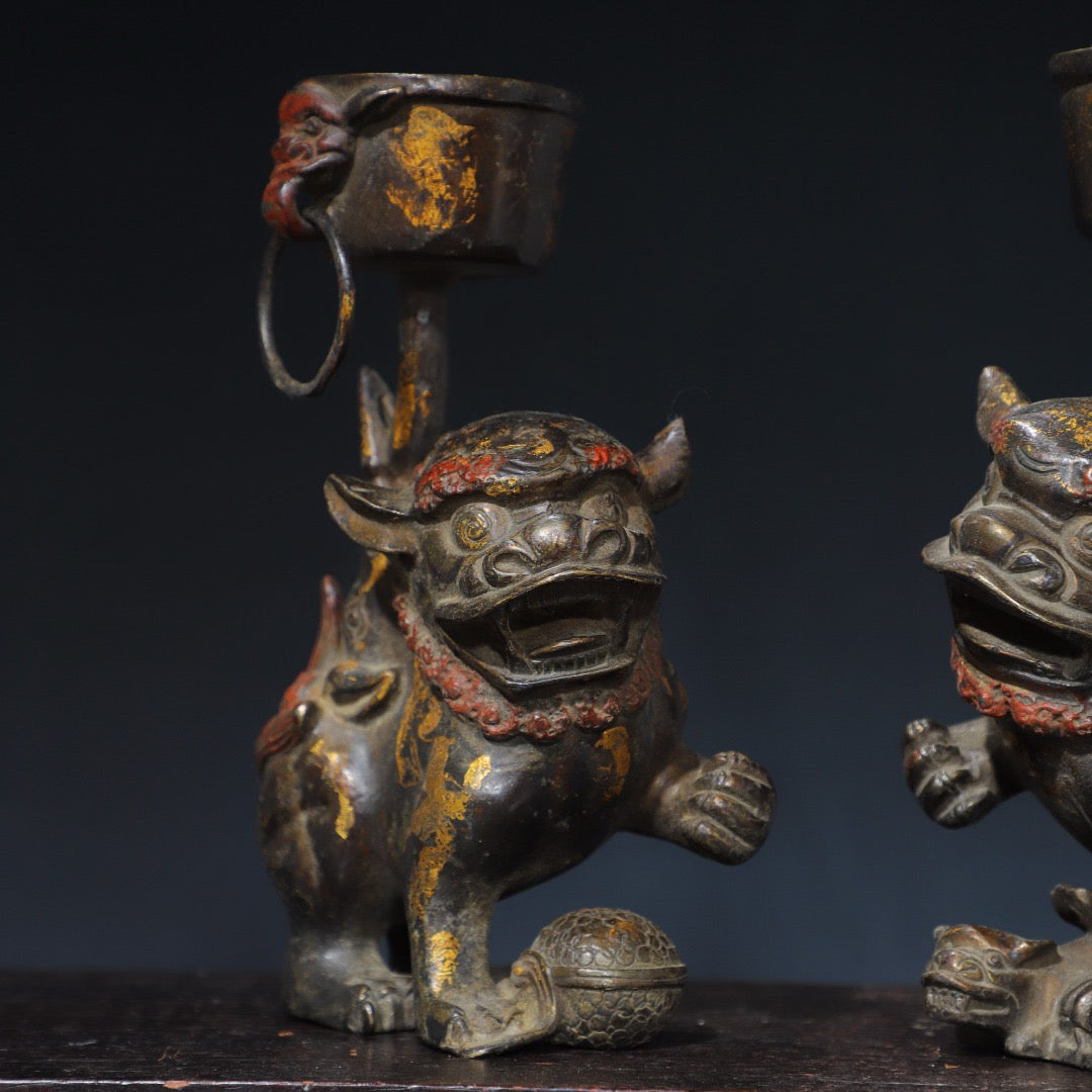 A pair of Chinese antique pure copper lion wax stands