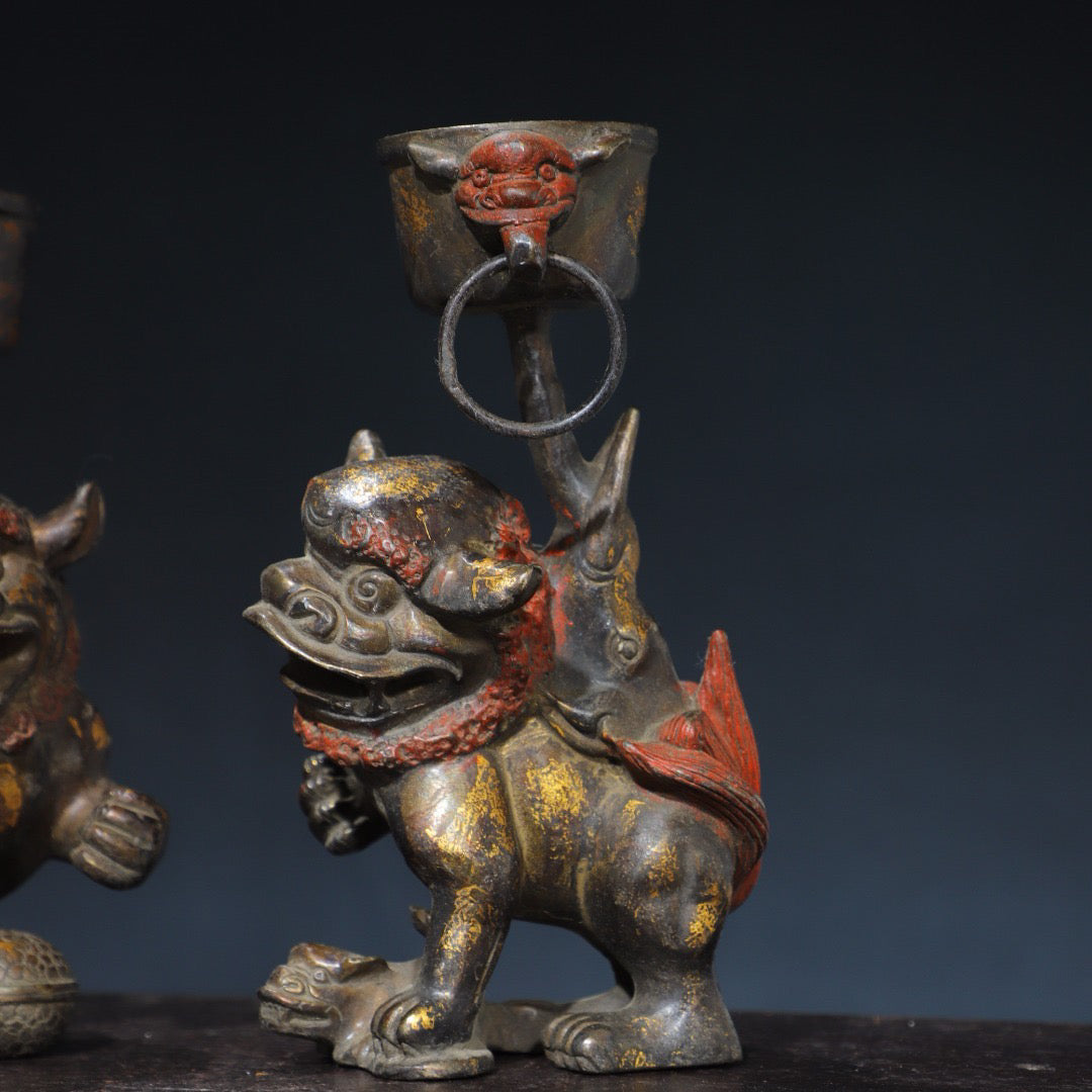 A pair of Chinese antique pure copper lion wax stands