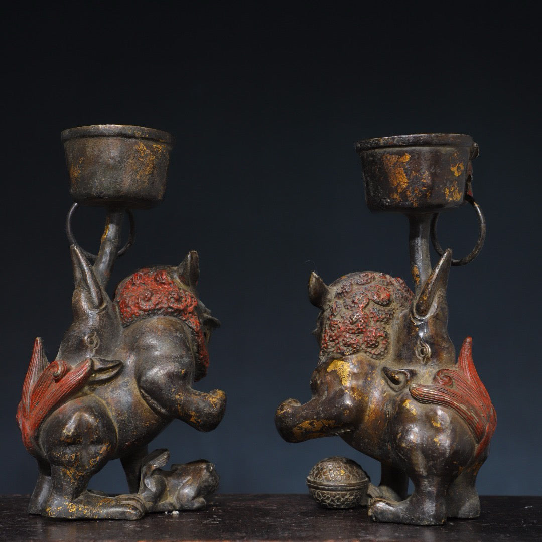 A pair of Chinese antique pure copper lion wax stands