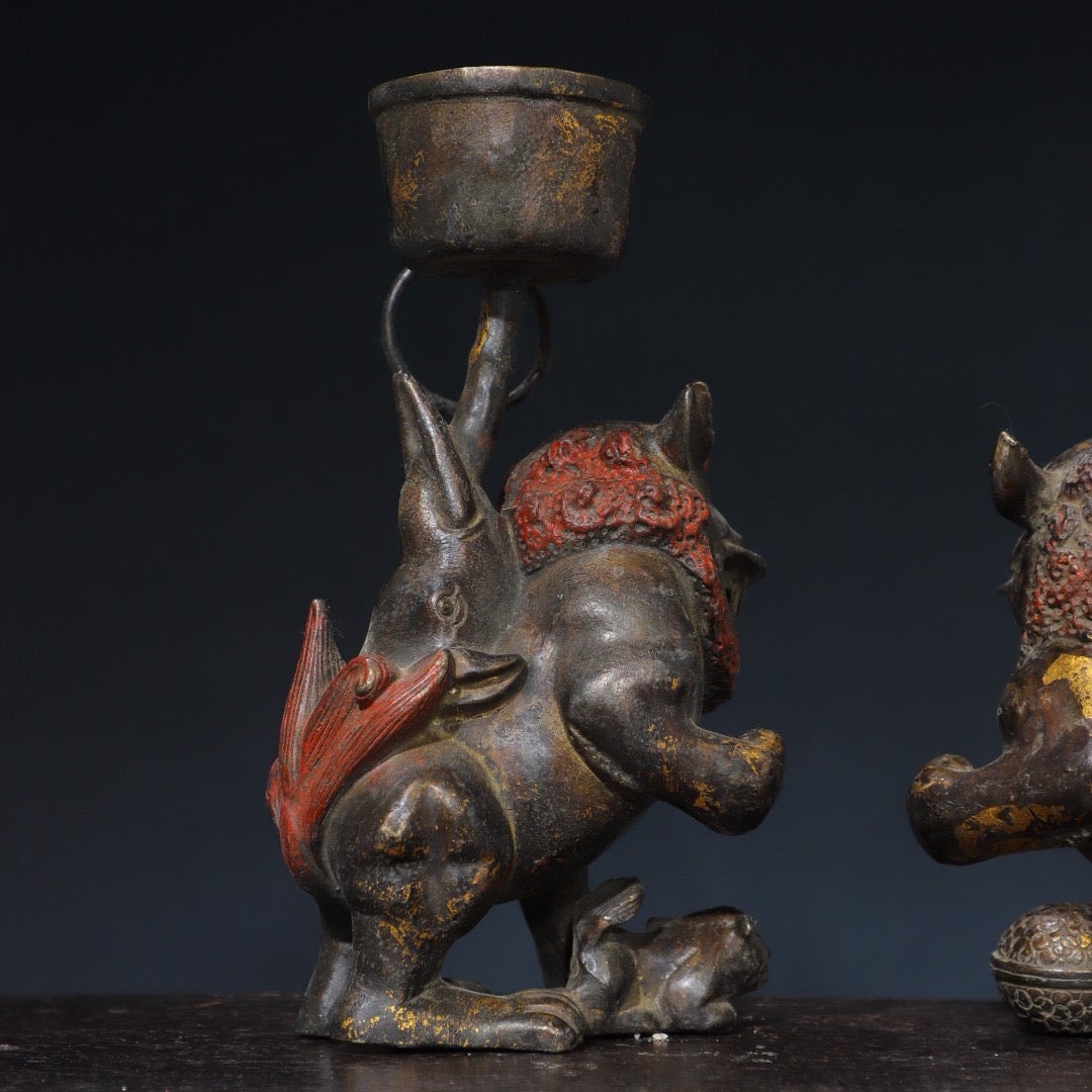 A pair of Chinese antique pure copper lion wax stands