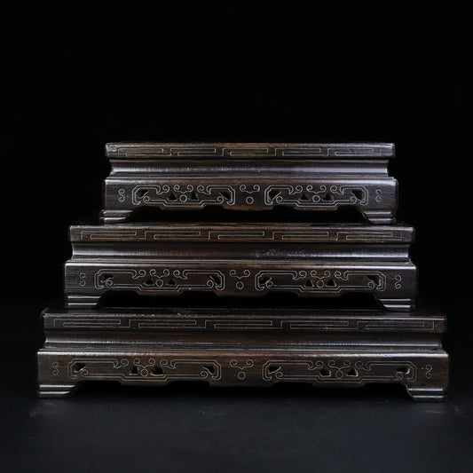 A set of rosewood silver wire rectangular base
