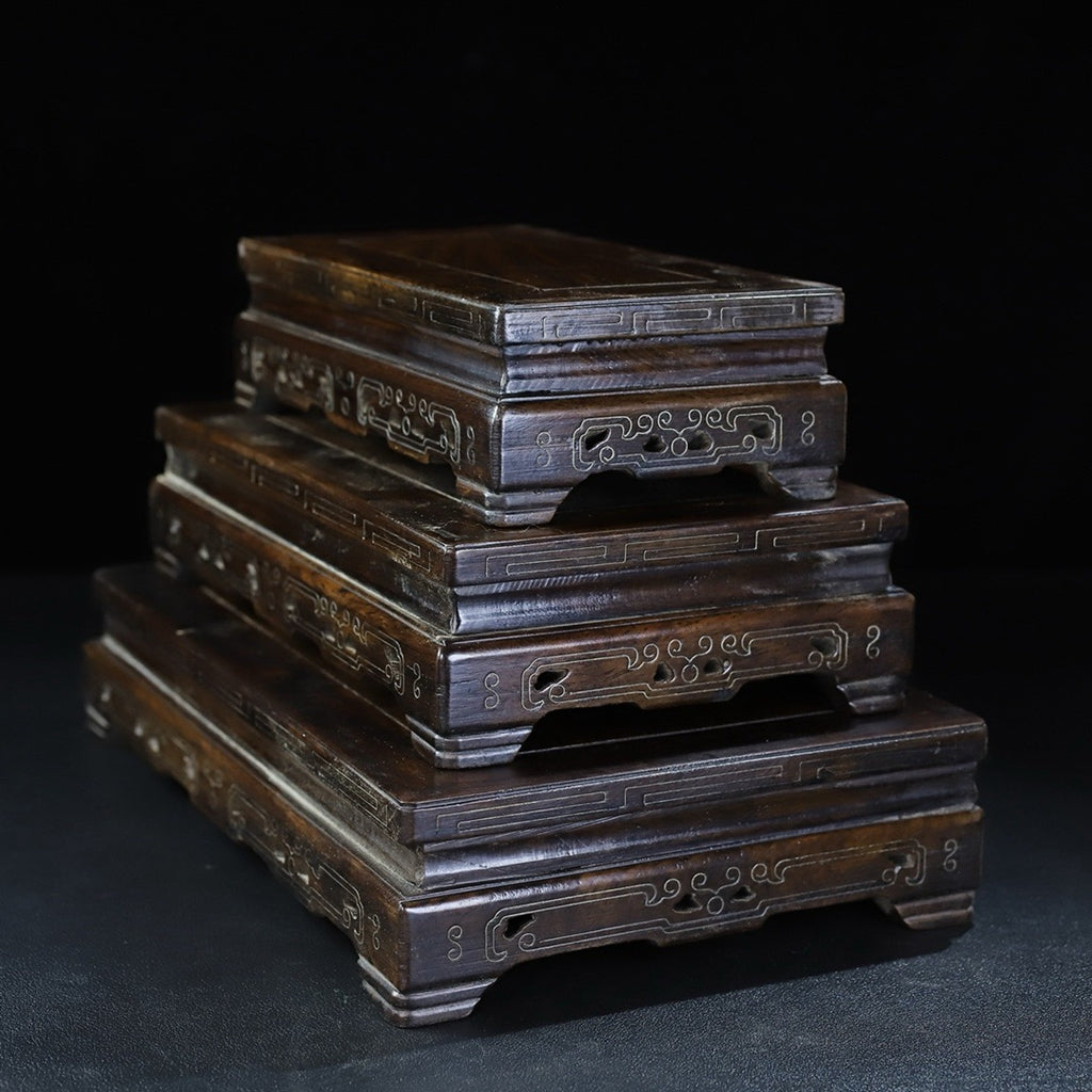A set of rosewood silver wire rectangular base