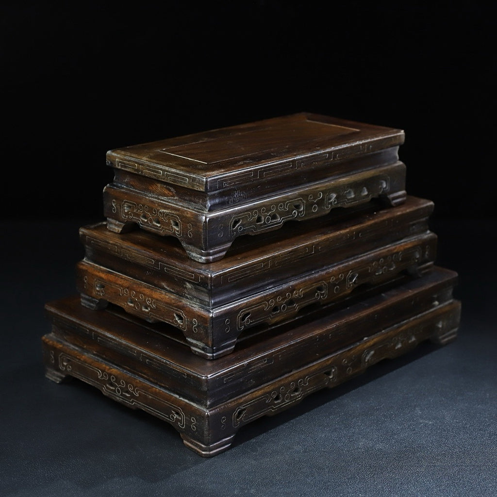 A set of rosewood silver wire rectangular base