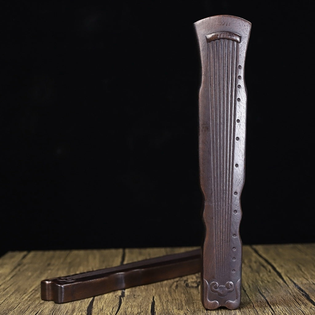 A pair of Huali wood carved Guqin weights and rulers