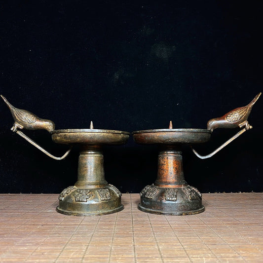 A pair of Chinese antique pure copper magpie wax stands