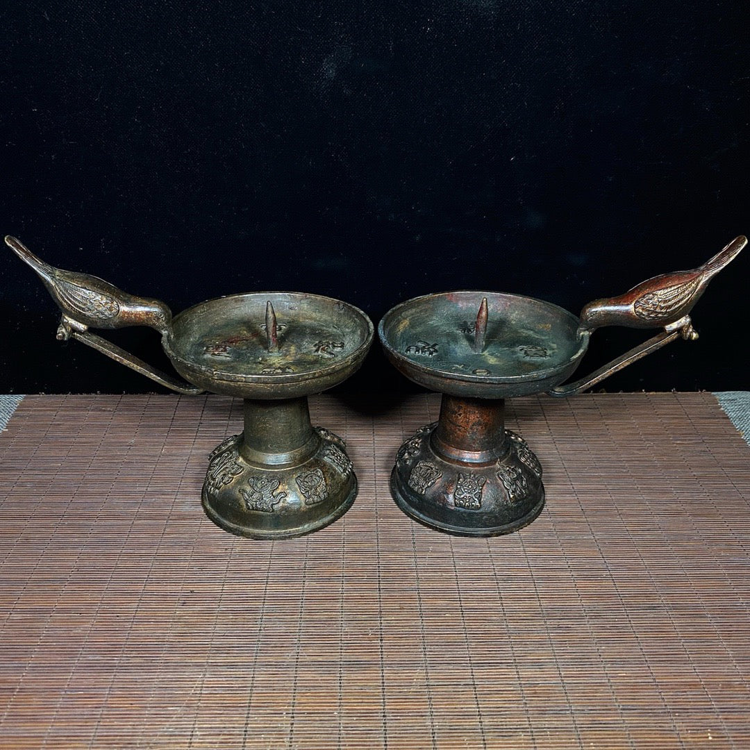 A pair of Chinese antique pure copper magpie wax stands