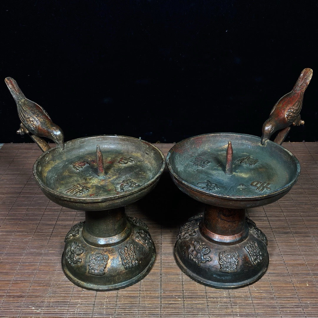 A pair of Chinese antique pure copper magpie wax stands