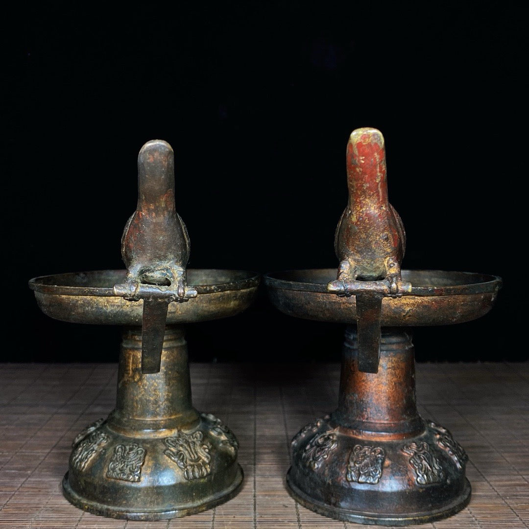 A pair of Chinese antique pure copper magpie wax stands