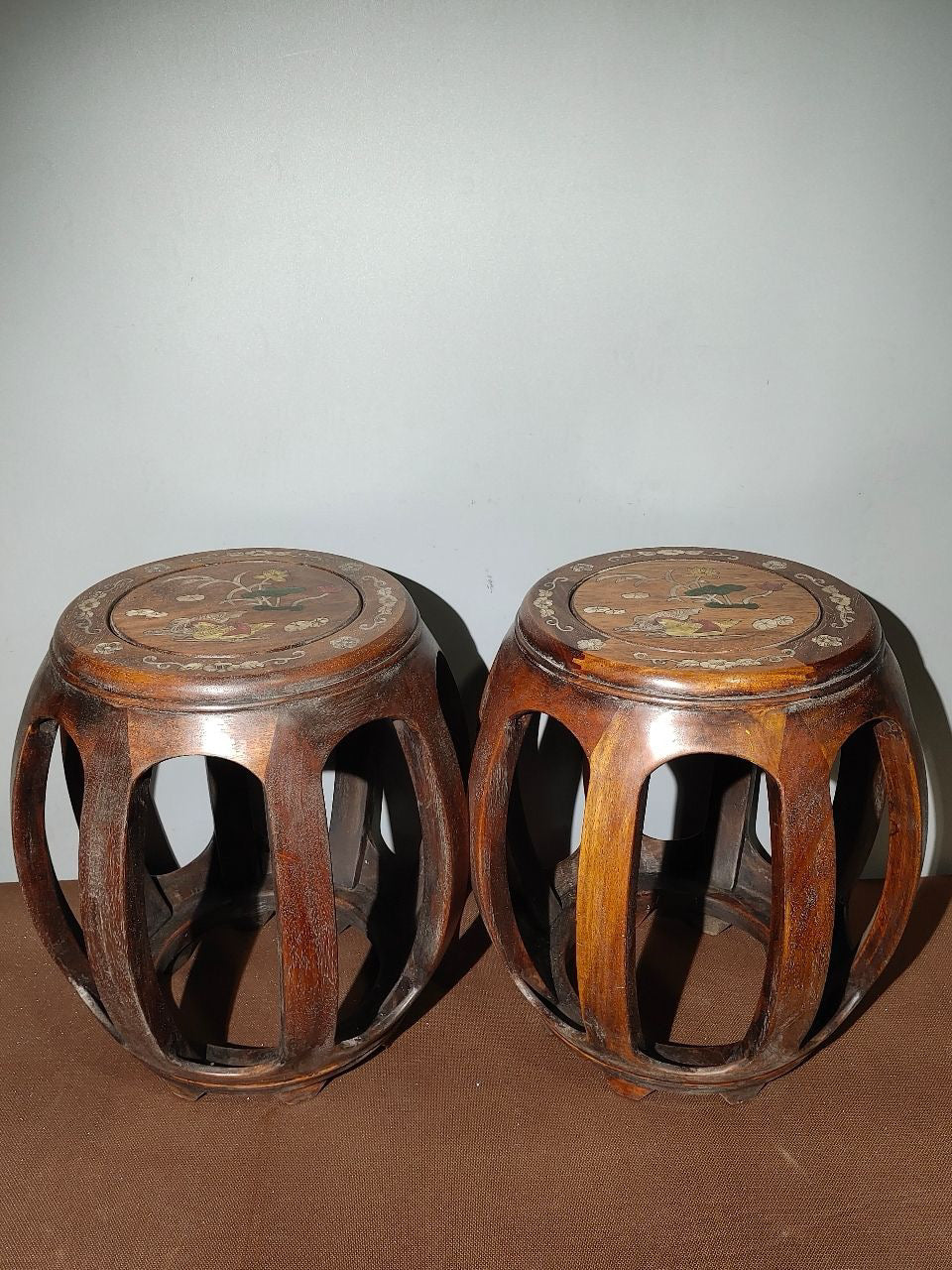 A pair of Chinese antique rosewood colored seashells and drum stools