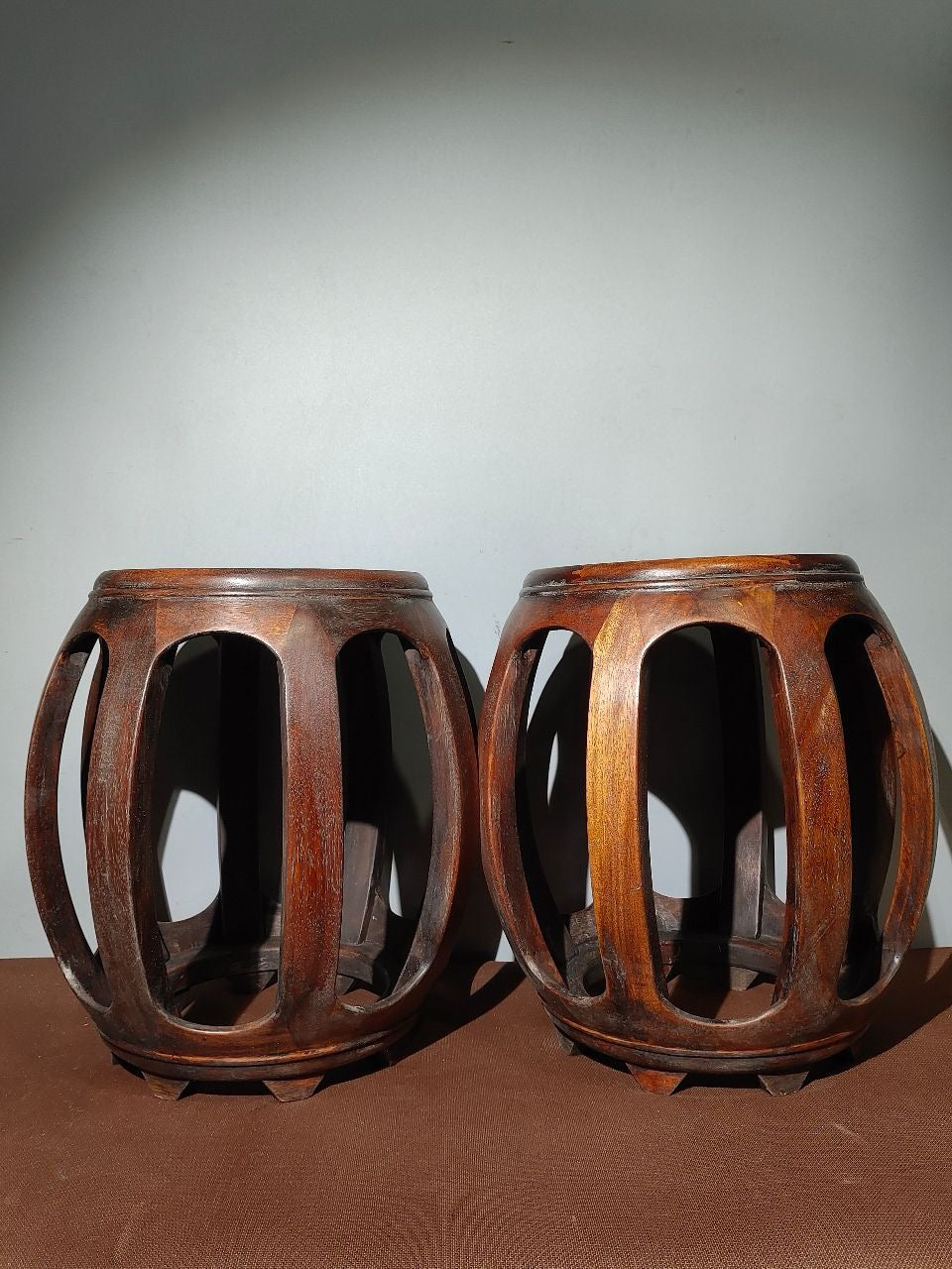 A pair of Chinese antique rosewood colored seashells and drum stools