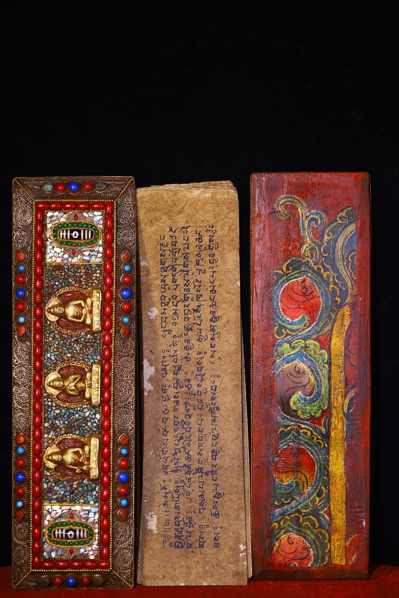 Handmade tapping, chiseling, colorful inlay of gemstones, old scriptures