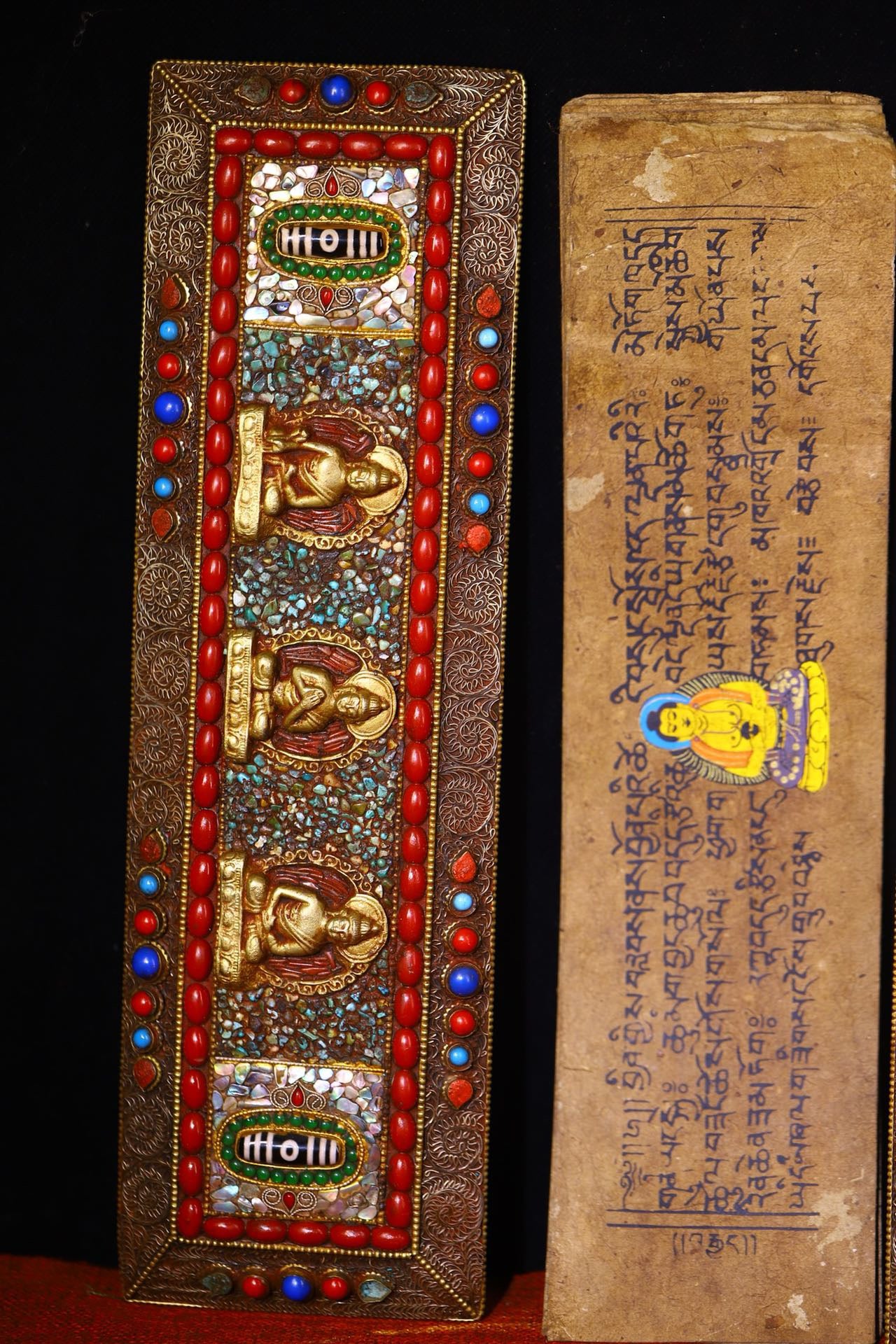 Handmade tapping, chiseling, colorful inlay of gemstones, old scriptures