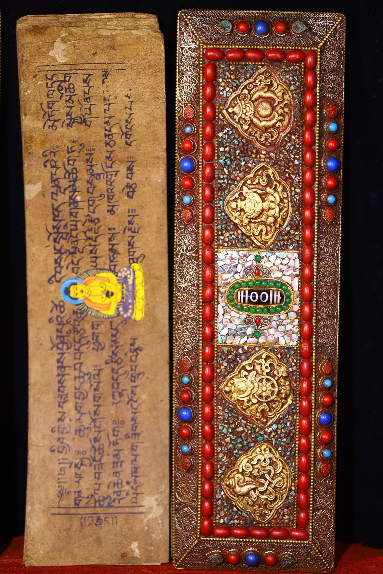 Handmade tapping, chiseling, colorful inlay of gemstones, old scriptures