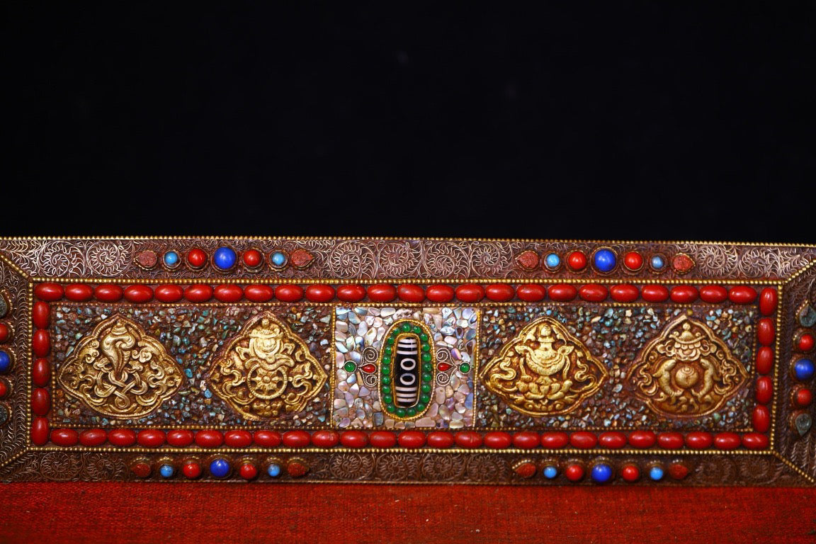 Handmade tapping, chiseling, colorful inlay of gemstones, old scriptures