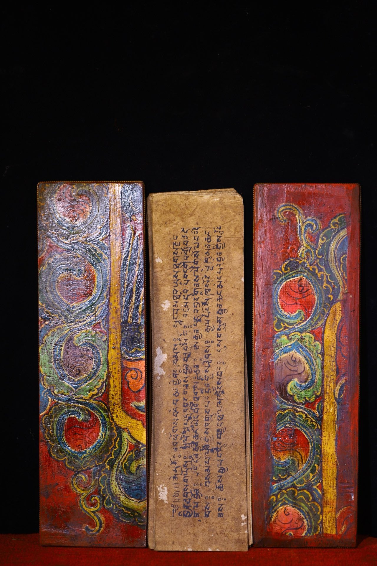 Handmade tapping, chiseling, colorful inlay of gemstones, old scriptures