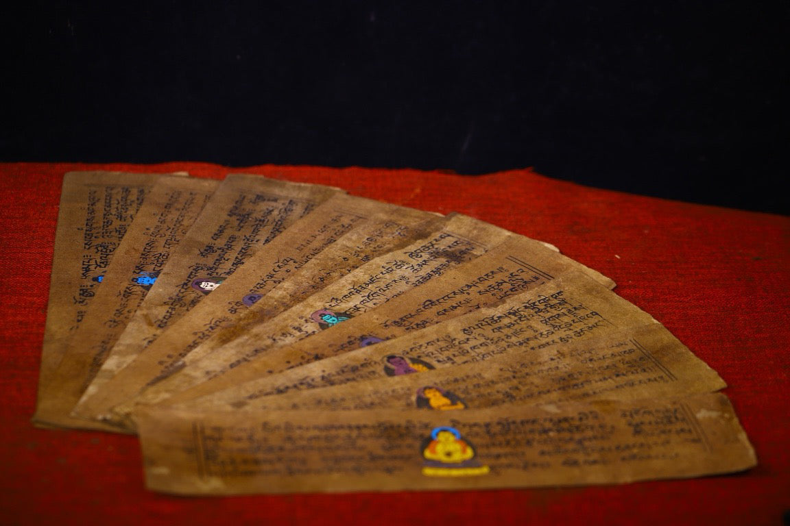 Handmade tapping, chiseling, colorful inlay of gemstones, old scriptures