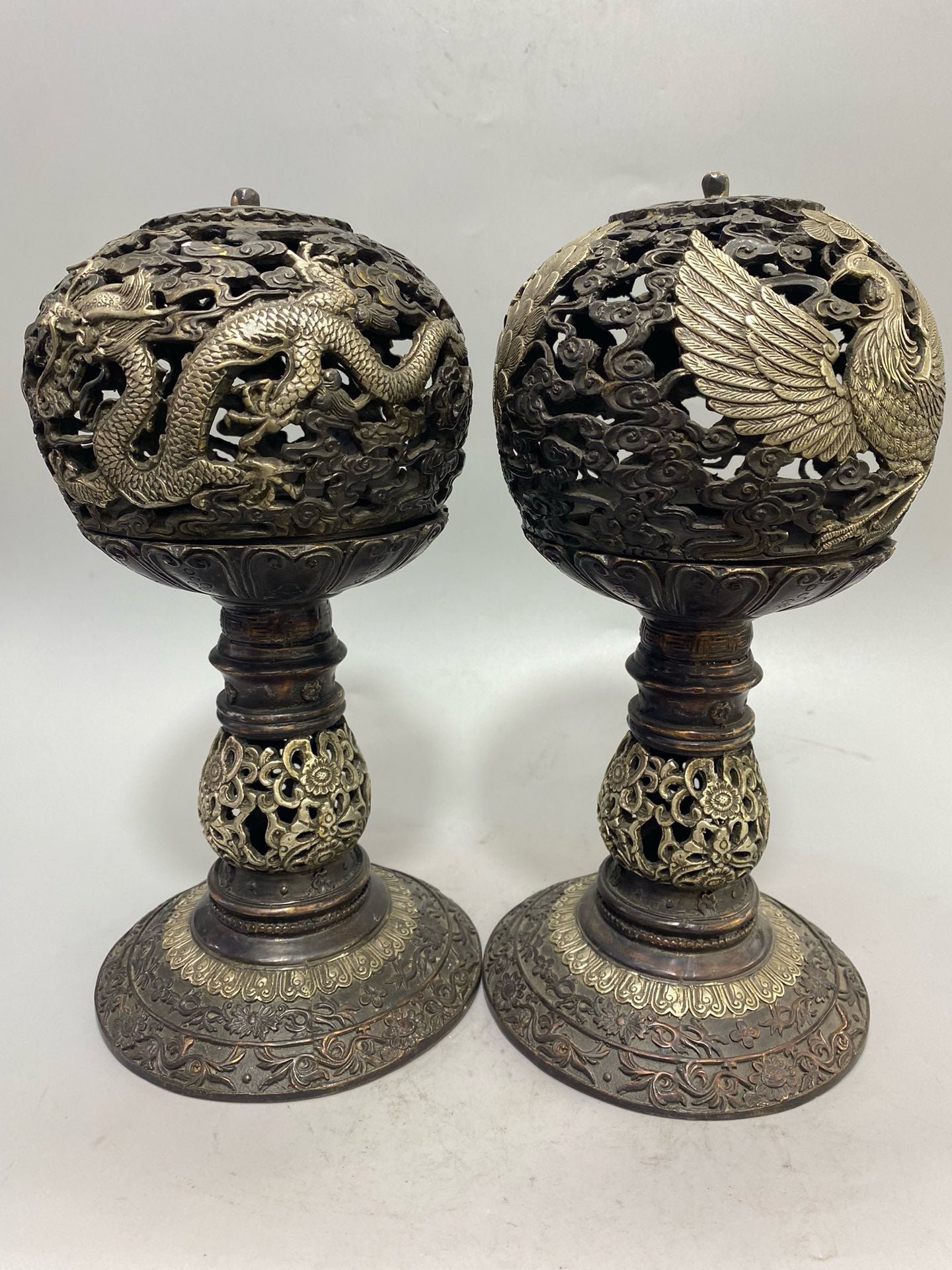 A pair of Chinese antique pure copper gilded silver dragon and phoenix aromatherapy furnaces