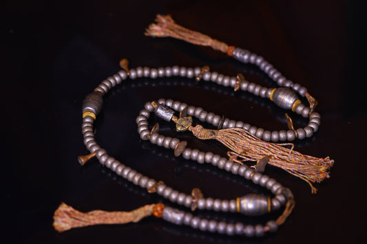 Tian Tie is purely handmade and has obvious signs of wear and tear on the carved Buddha beads