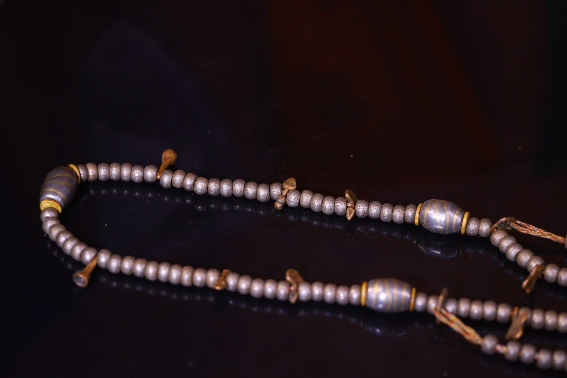 Tian Tie is purely handmade and has obvious signs of wear and tear on the carved Buddha beads