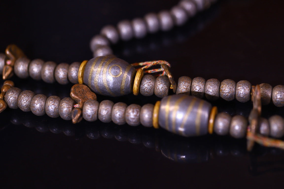 Tian Tie is purely handmade and has obvious signs of wear and tear on the carved Buddha beads