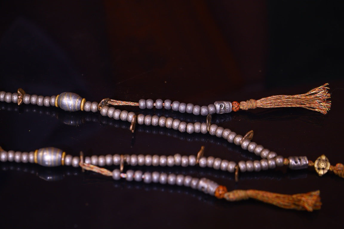 Tian Tie is purely handmade and has obvious signs of wear and tear on the carved Buddha beads