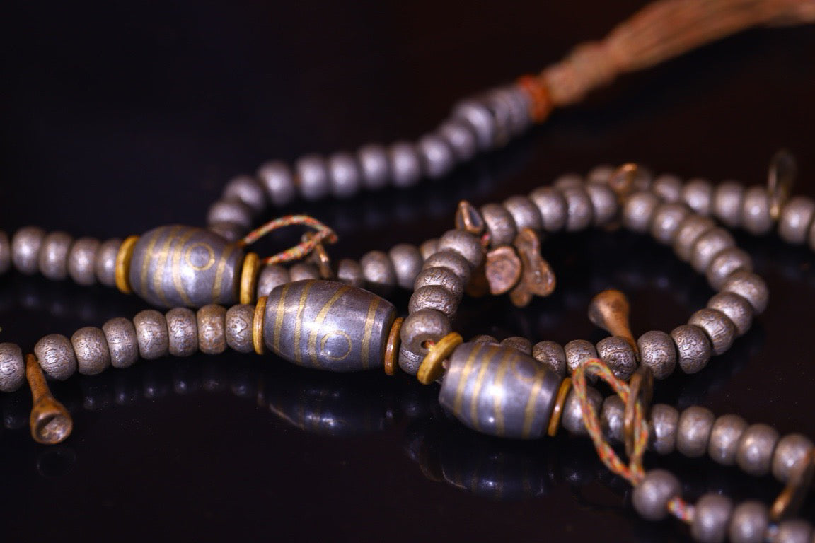 Tian Tie is purely handmade and has obvious signs of wear and tear on the carved Buddha beads