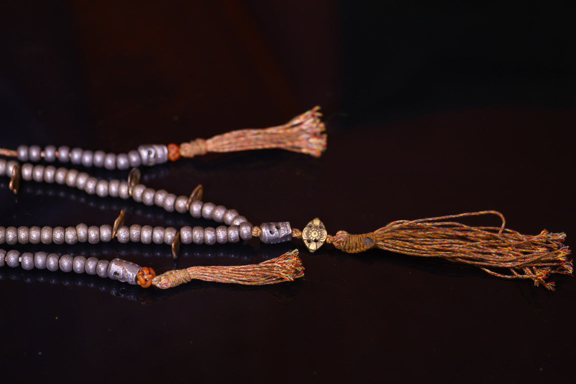 Tian Tie is purely handmade and has obvious signs of wear and tear on the carved Buddha beads