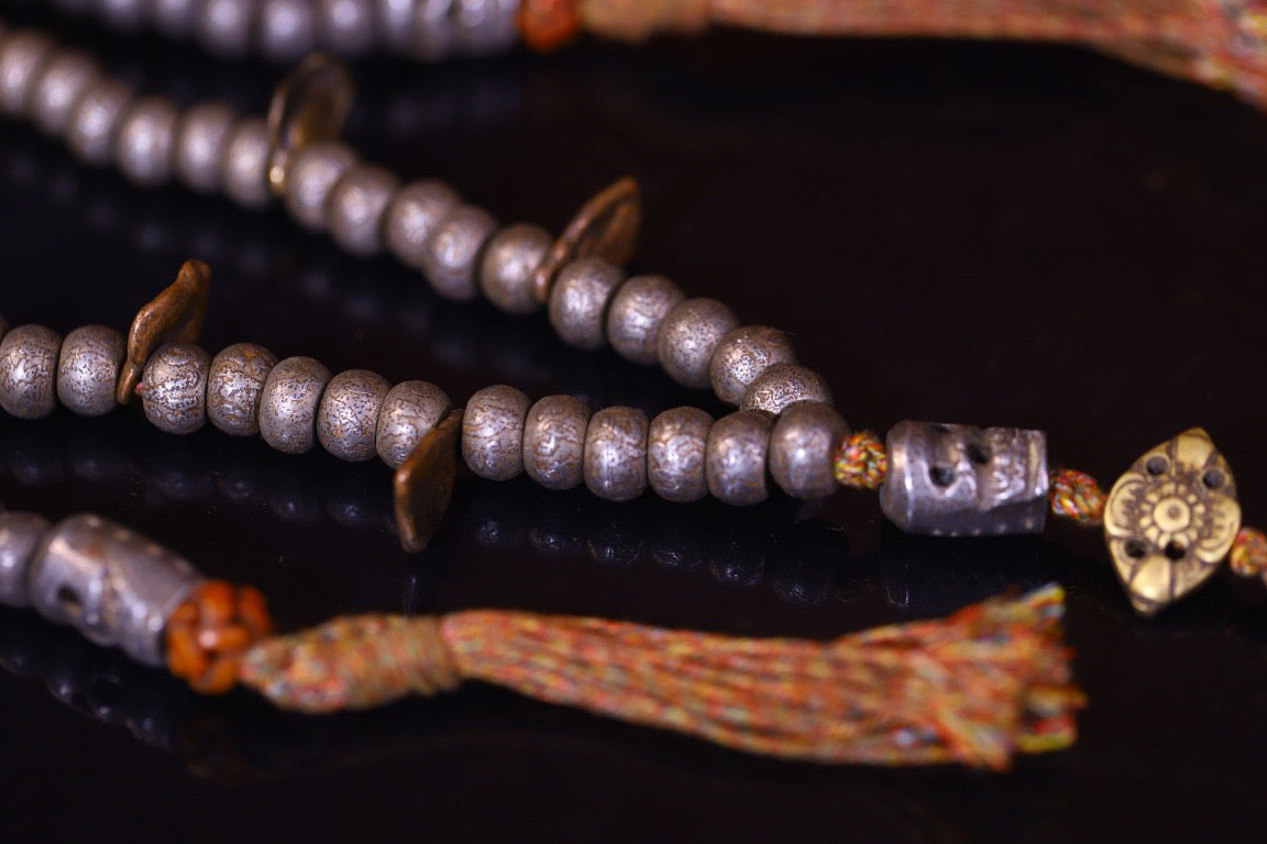 Tian Tie is purely handmade and has obvious signs of wear and tear on the carved Buddha beads