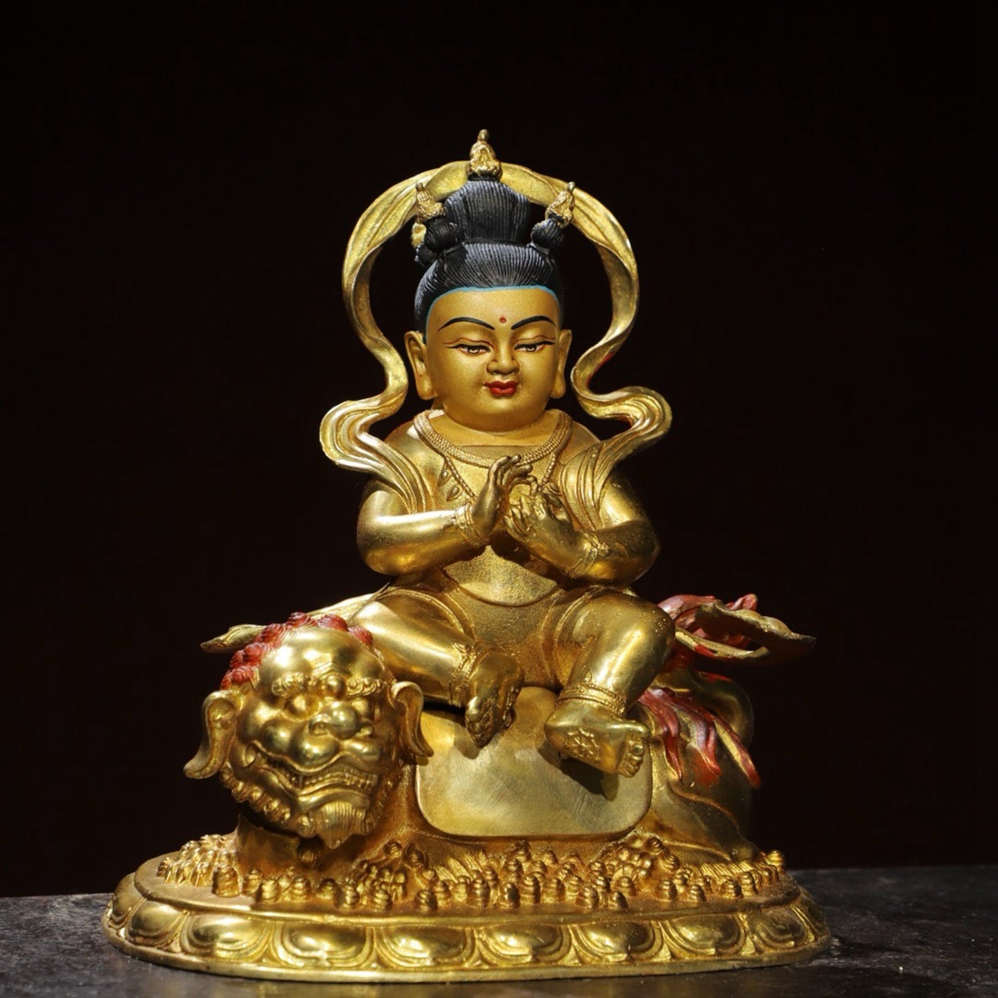 Bronze painted [Boy Riding Beast] Buddha statue