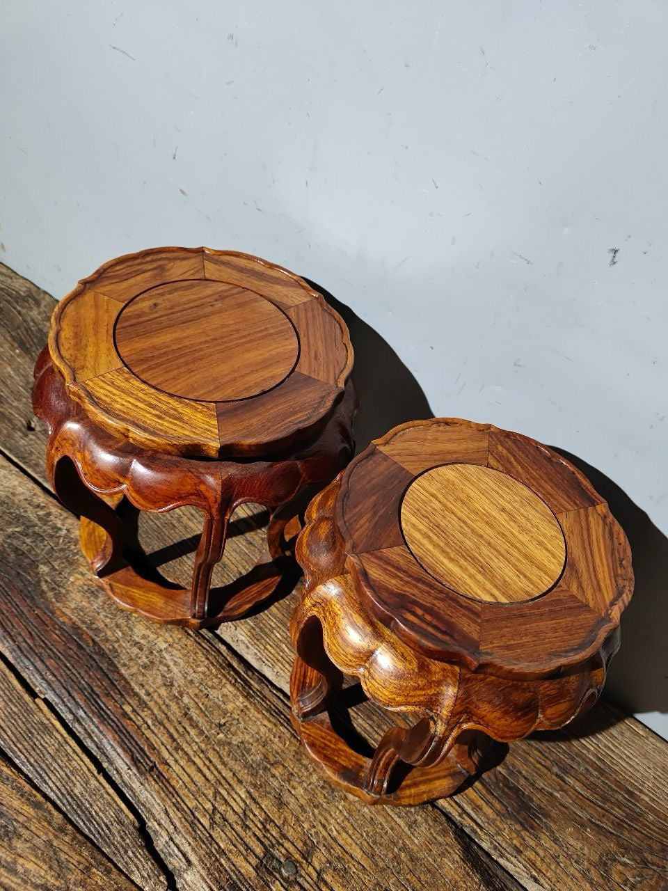 A pair of Chinese antique rosewood bent leg flower rack ornaments