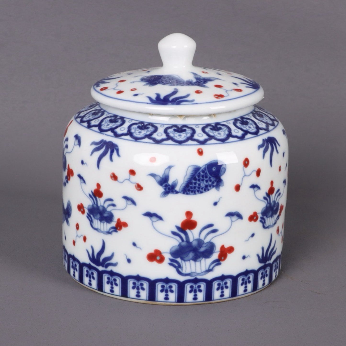 Blue and white glazed red fish algae patterned tea jar