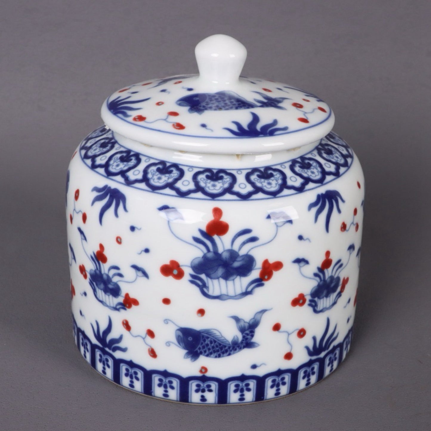 Blue and white glazed red fish algae patterned tea jar