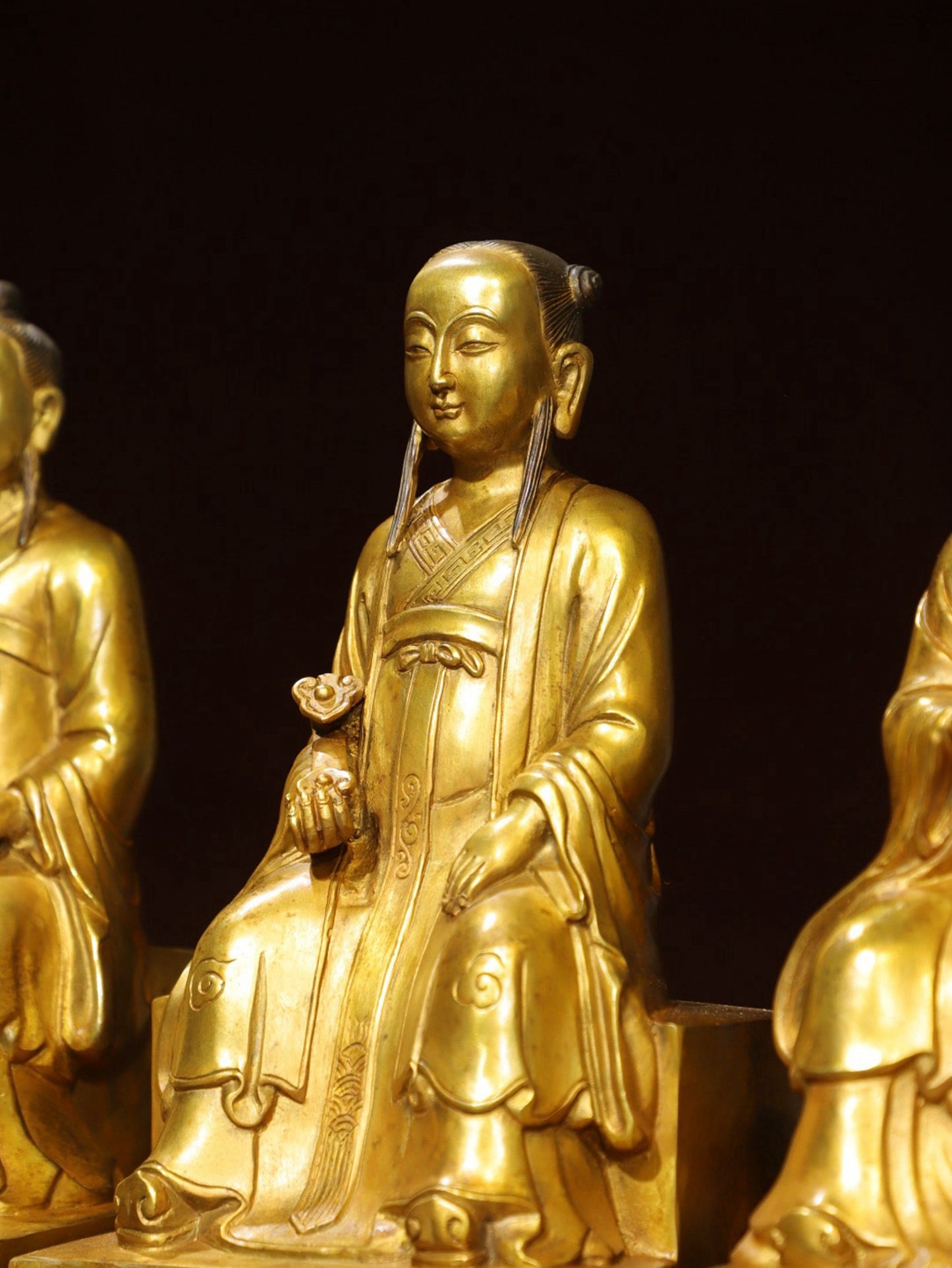 A set of bronze gilded Buddha statues of Sanmao Zhenjun