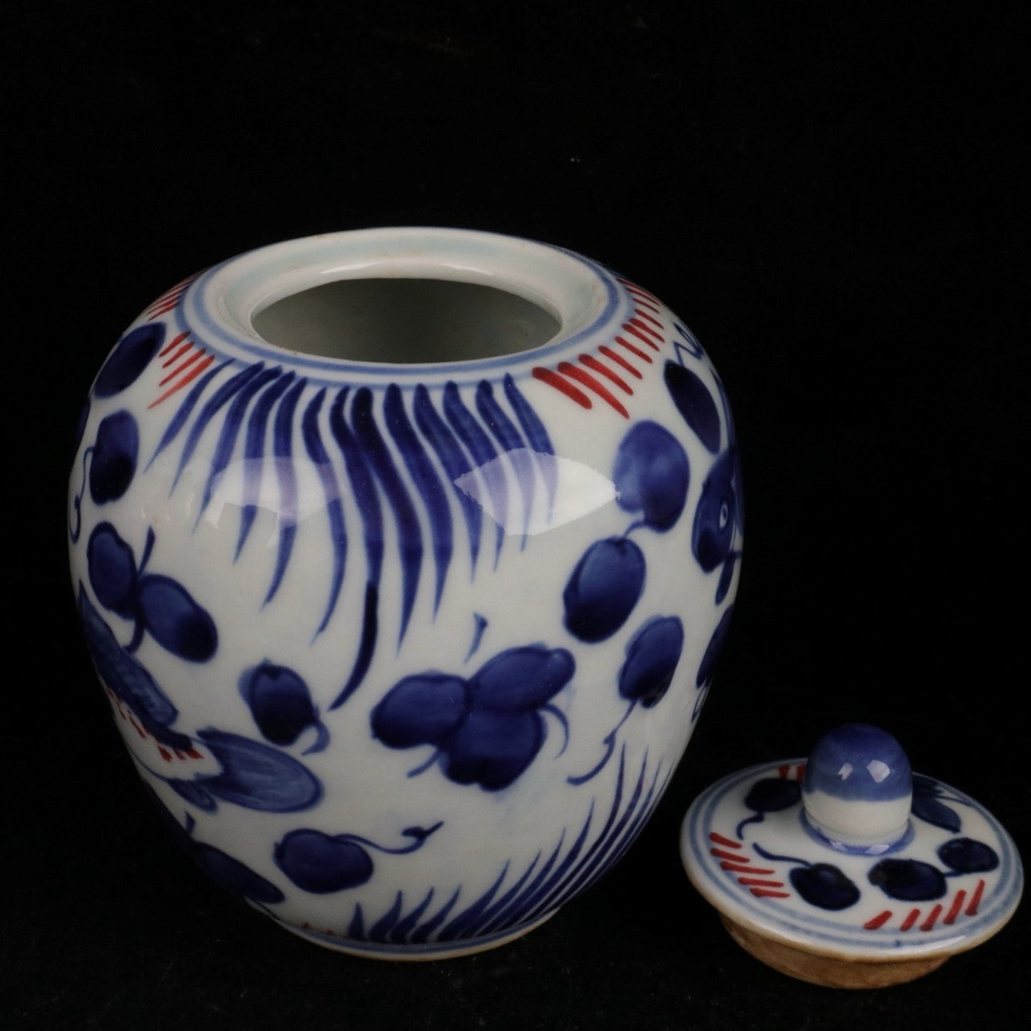 Blue and white glazed red fish and algae patterned small jar