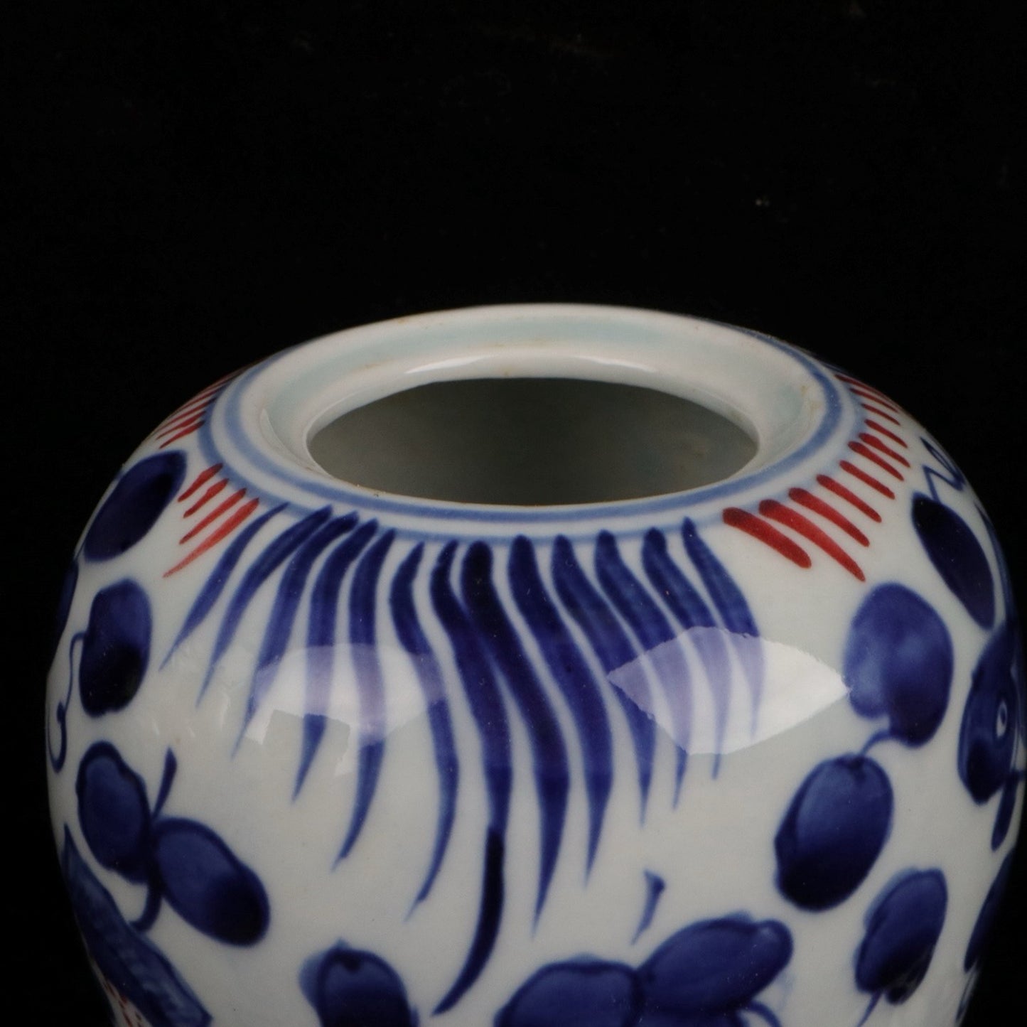 Blue and white glazed red fish and algae patterned small jar