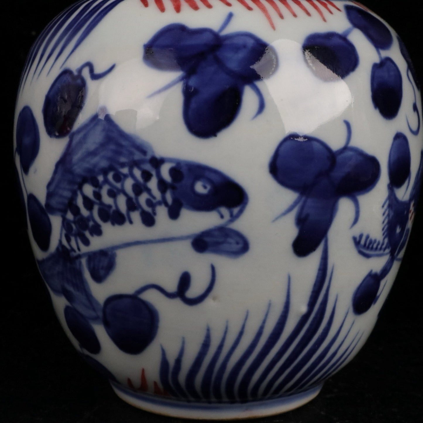 Blue and white glazed red fish and algae patterned small jar