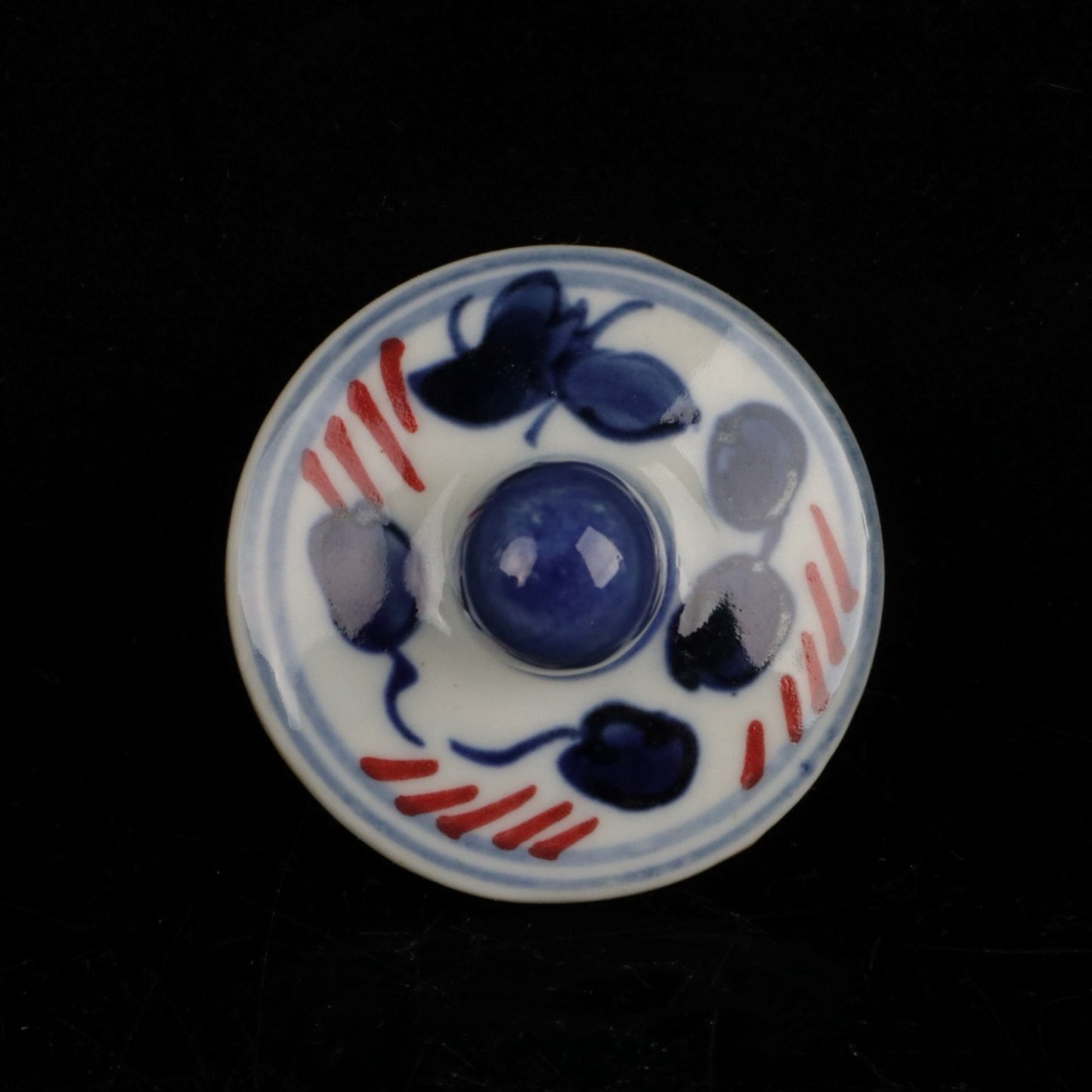 Blue and white glazed red fish and algae patterned small jar