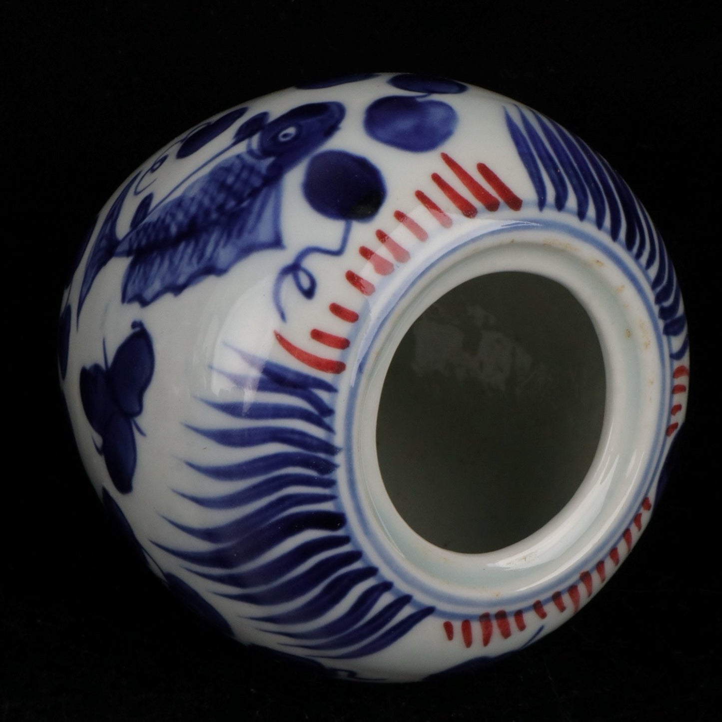 Blue and white glazed red fish and algae patterned small jar