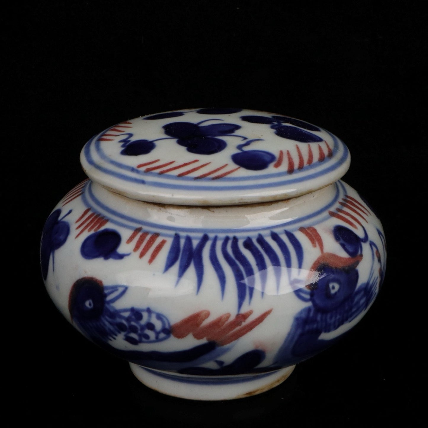 Blue and white glazed patterned flat top jar