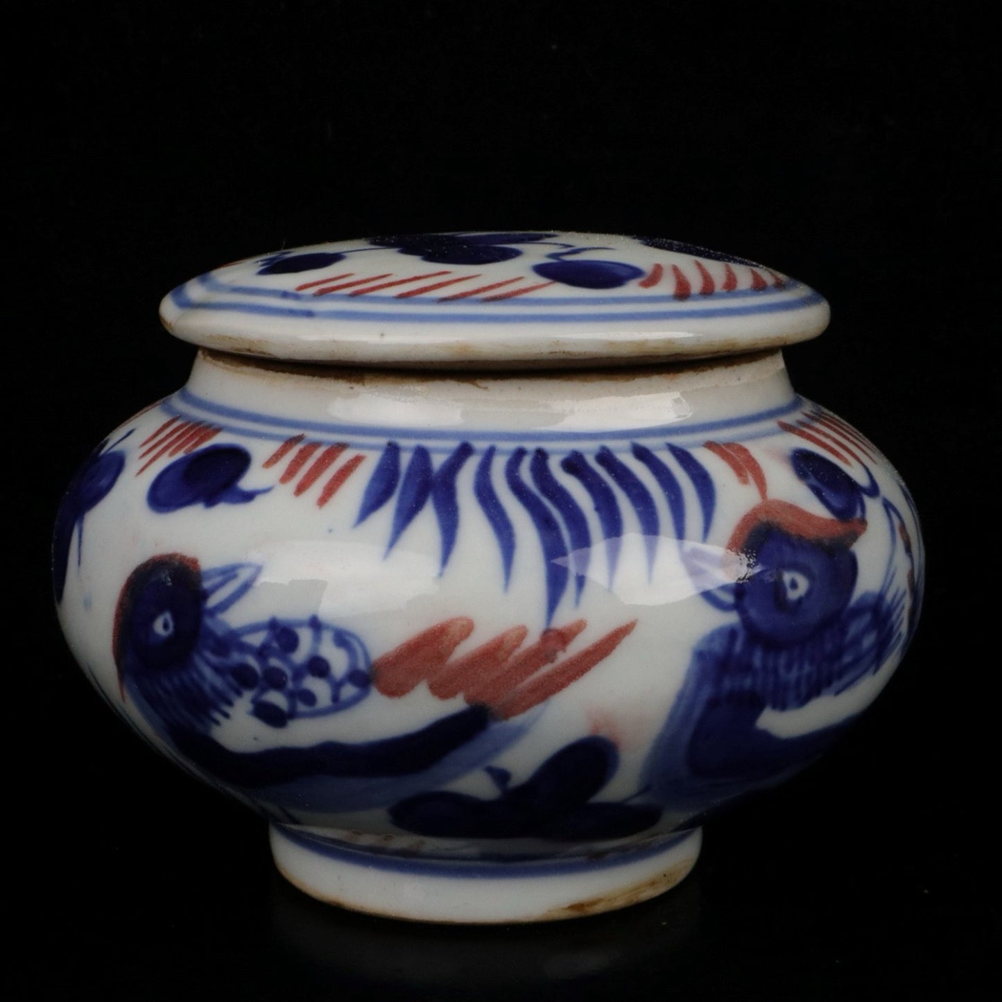 Blue and white glazed patterned flat top jar