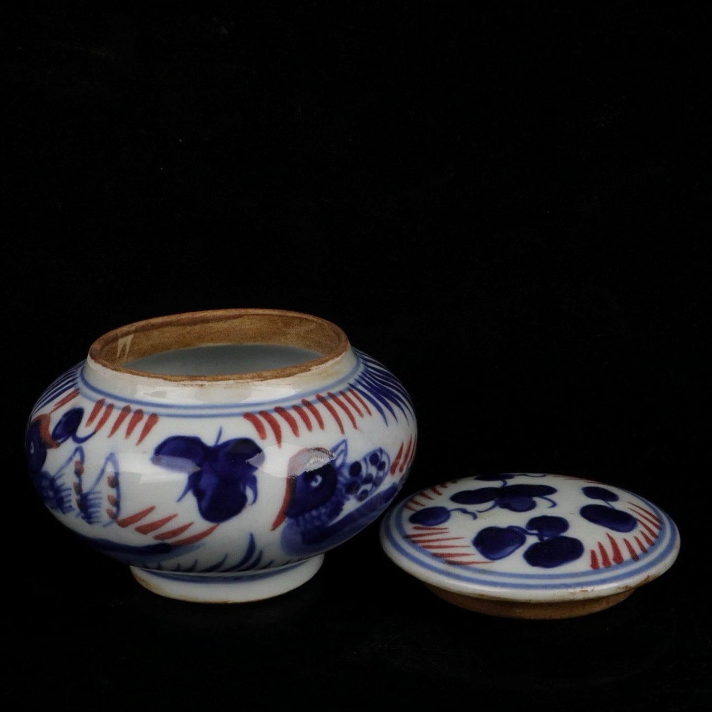 Blue and white glazed patterned flat top jar
