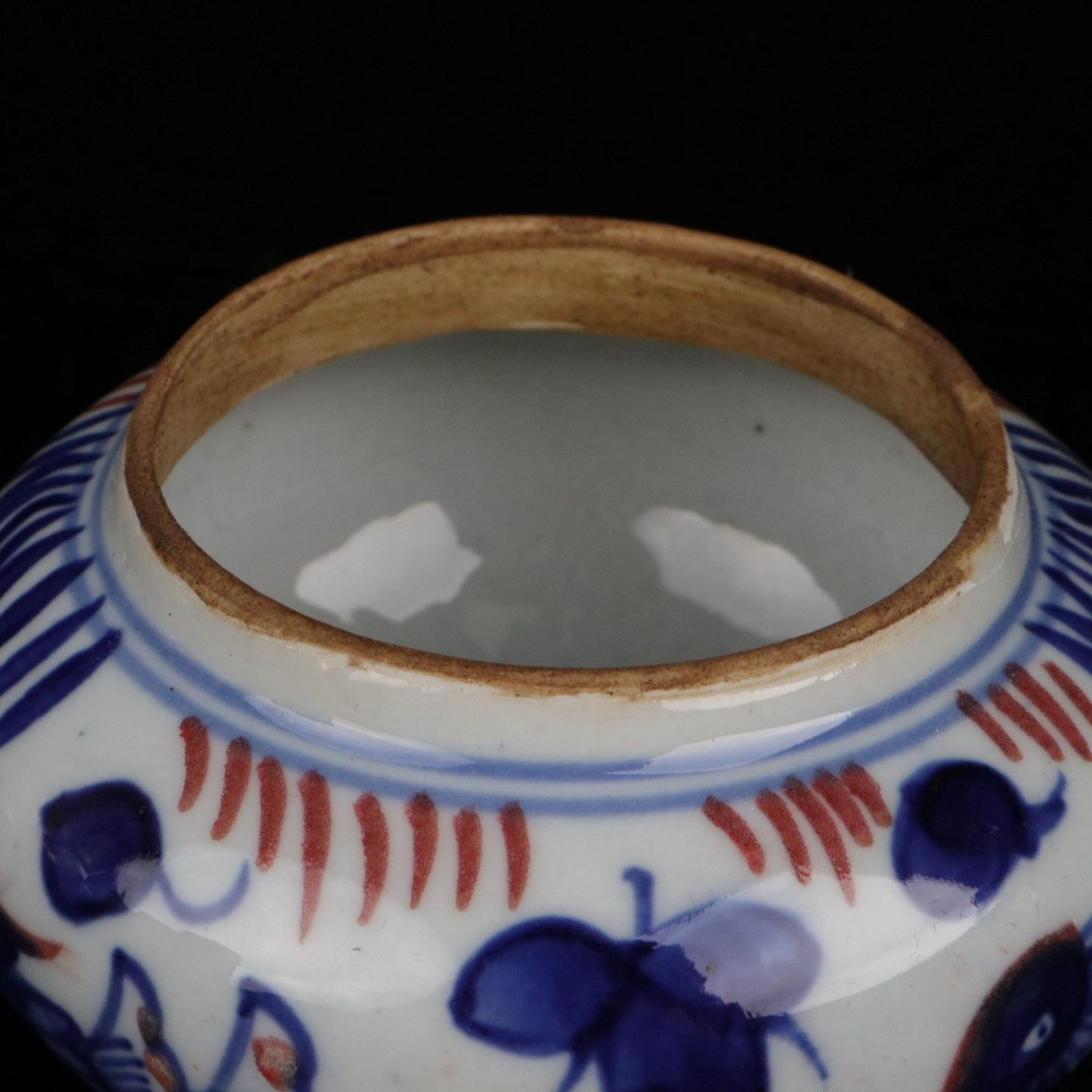 Blue and white glazed patterned flat top jar