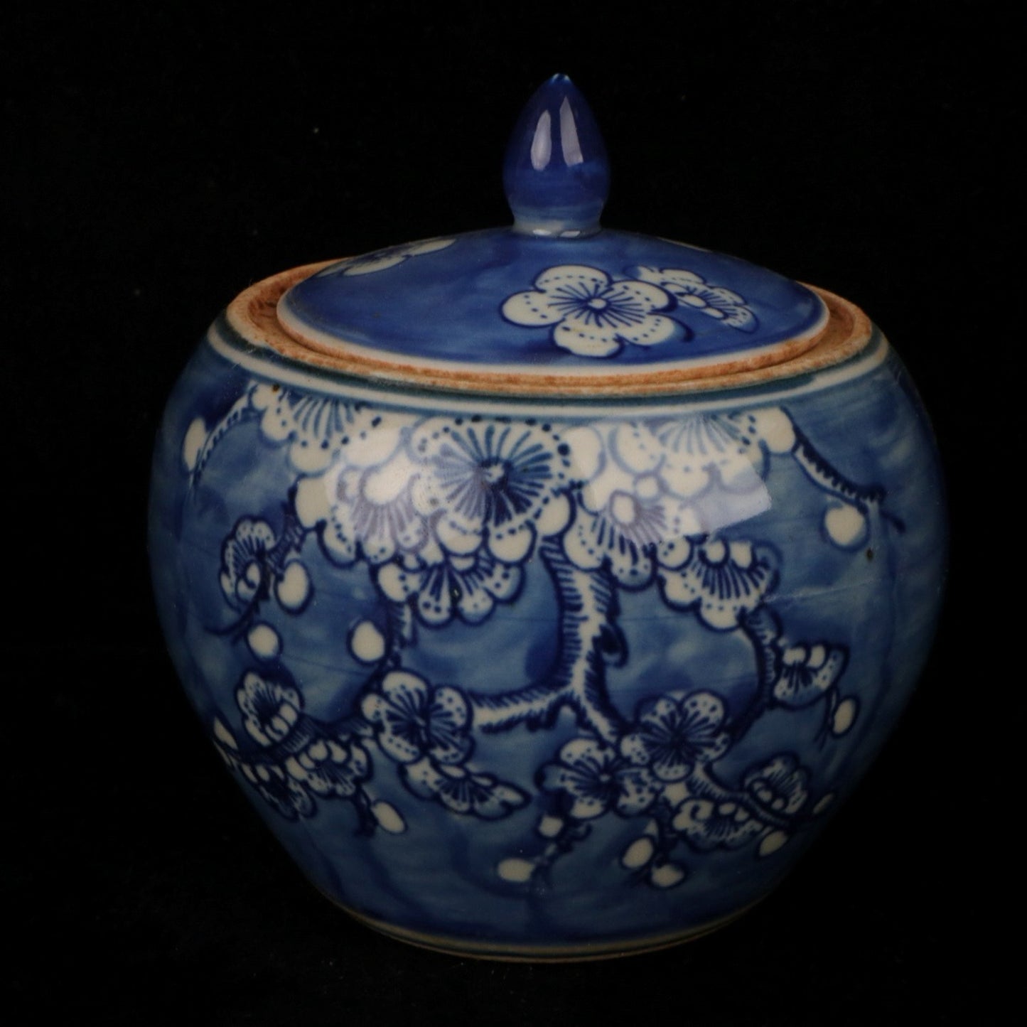 Blue and white plum blossom patterned lid jar